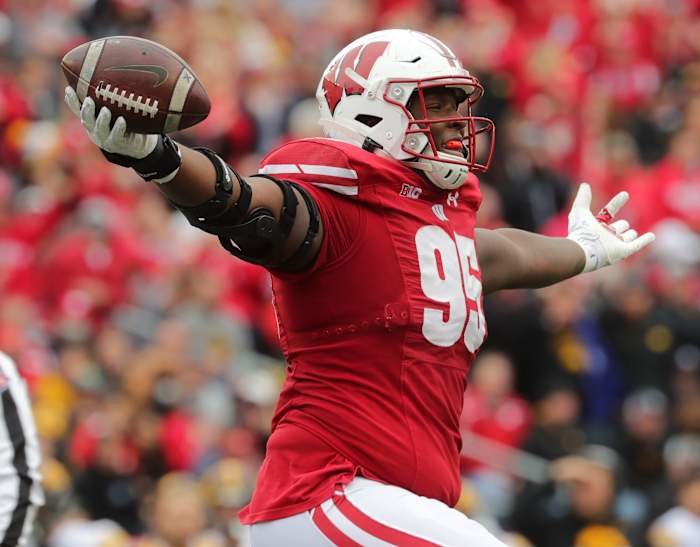 Wisconsin defensive lineman Keeanu Benton celebrates a fumble recovery.
